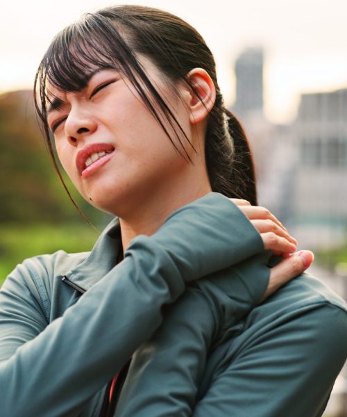Outdoor, woman and fitness with neck pain from workout strain with muscle ache and injury in Japan