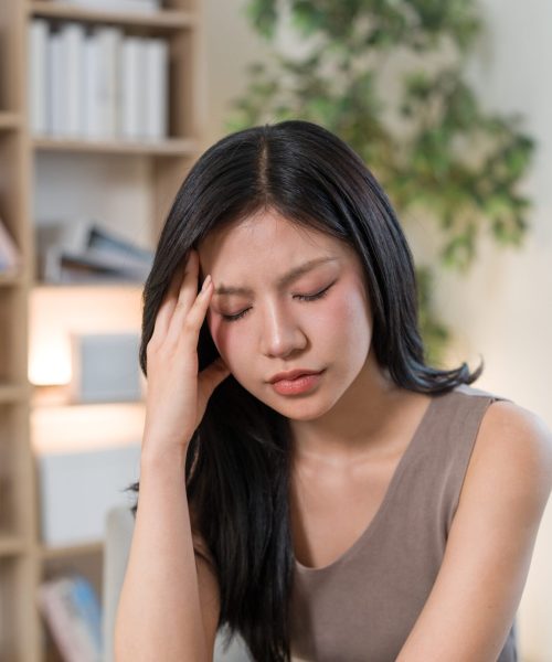 young-woman-at-home-holding-her-head-in-pain-2026-08-31-15-58-55-utc (1)